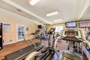 Fitness Center with Treadmills, Tv and Vending Machine. 