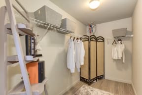 Master Bedroom Closet with Shelves, Hanging White T-Shirts, Book Case, Clothes Changing Folding Screen