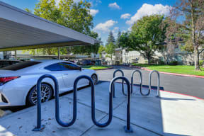 Community bike racks located though out the property.  There are two featured next to the carport parking structure.