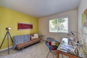 Guest Bedroom with Desk, Brown Sofa, Carpet and Window