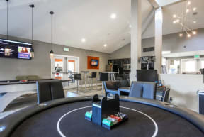 Office with Poker Table, Flat Screen Television, Pool Table, Exit Sign and Black Cabinents