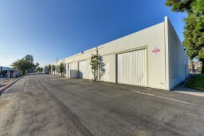 Oak Business Center parking lot showing building with larger warehouse doors. 