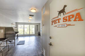 Entrance to the community pet spa.  Spa includes large stainless tub for washing.