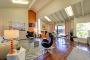 The Pinecrest Apartment Leasing office with seating options, vaulted ceilings, and large windows. at Pinecrest Apartments, Davis, CA