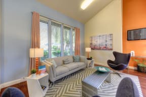 The Pinecrest Apartment Leasing office with seating options, coffee table and large windows. at Pinecrest Apartments, Davis, CA, 95616