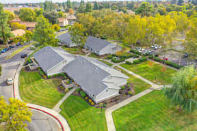 a birdseye view of the Pinecrest apartment community with homes and trees at Pinecrest Apartments, California, 95616