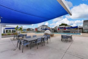 Pool and Seating Area, Blue Sun Cover, Tables, Blue Seats, Blue Skies and Clouds