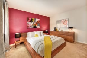 Red Wall Bedroom with Full Sized Mattress and Wooden Frame, White Comforter and Yellow Blanket, Wood Dresser, Abstract Painting