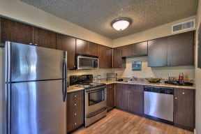  Kitchen with Stainless Steel Appliances Refrigerator Microwave Oven Stove and Dishwasher