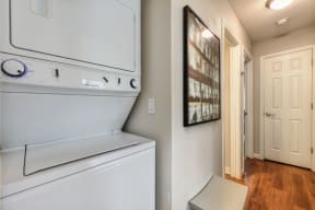 Washer Dryer with Wood Inspired Floor, White Doors, Ceiling Lights