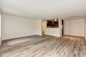 Vacant apartment home located on the first floor with hardwood inspired flooring through out with views of the open concept kitchen and dining area. 