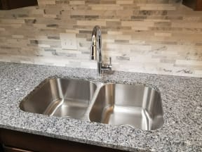 Under mount Sink, Goose Neck Faucet, Granite Top, and Back-splash