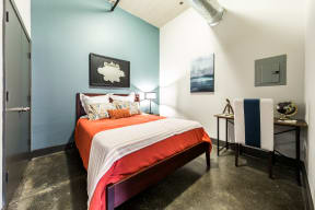 East End Lofts apartment bedroom with exposed ductwork 