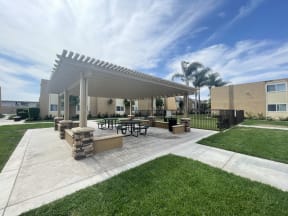 Dog Park and Outdoor Shaded Seating at Whiffle Tree Apartment homes in Huntington Beach, CA.