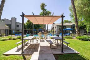 BBQ Dining and Seating Evria Apartment Homes in Diamond Valley California.