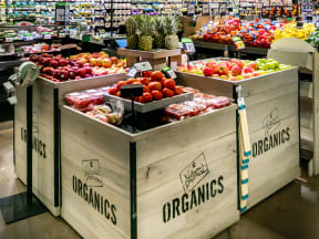 a nice display of organic fruits in a big grocery store