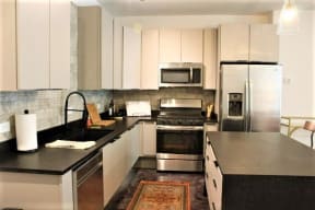 Kitchen appliances and cabinets at The Mobile Lofts, Mobile, AL