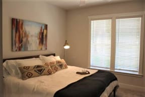 Bedroom with cozy bed. window and frame at The Mobile Lofts, Alabama, 36604