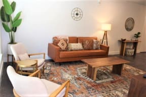 Living room decor with lamp and indoor plants at The Mobile Lofts, Mobile, AL, 36604