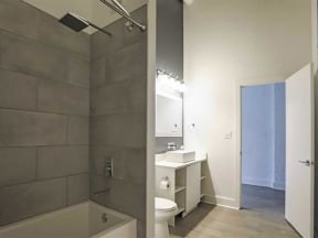 Bathroom with shower and tub at The Mobile Lofts, Mobile, AL