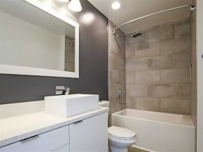 Bathroom with mirror at The Mobile Lofts, Alabama, 36604