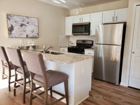 side kitchen view stainless steel appliances