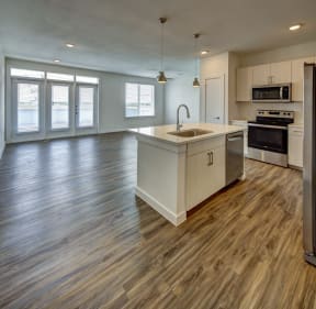 kitchen with a view of living room at Brixton South Shore, Austin, TX, 78741