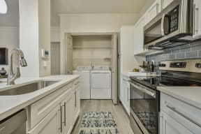kitchen with view of indoor laundromat