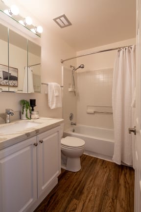 Walnut Hill Apartments in Walnut Creek, CA apartment home bathroom with white cabinetry and full bath