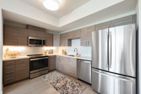 Apartments in San Rafael for Rent - Bright Kitchen with Wood Flooring, Stainless Steel Appliances, and Tiled Backsplash