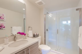 Full size bathroom with tub and vanity