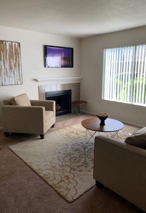 Living room with fireplace | Riverstone apts in Sacramento, CA 95831