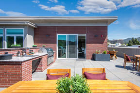 Apartments for Rent San Rafael, CA - Community Rooftop BBQ Area with Tables and Seating