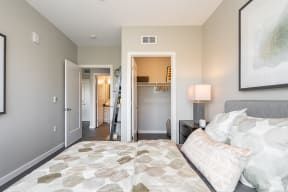 Bedroom with closet and view to other rooms