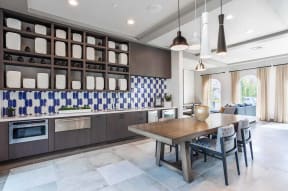 Clubhouse seating and kitchen Ageno Apartments | Livermore, CA