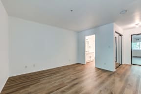 ALUR Apartments in Pasadena, CA with hardwood flooring, walk-in closet, and white walls