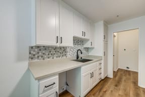 Apartments for Rent in Pasadena, CA - ALUR Kitchen with stainless steel appliances, and modern dark wood cabinets