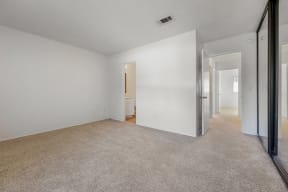 Carpet in bedroom and view of hallway