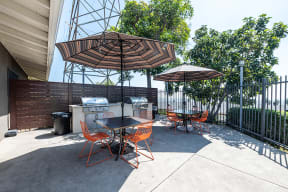 BBQ area with seating  l Emerald Hills Apartments in Monterey Park