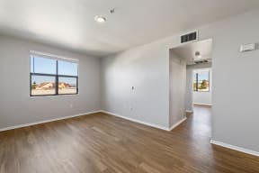 a bedroom with hardwood floors and grey walls at K Street Flats, California