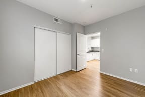 a bedroom with two closets and hardwood floors at K Street Flats, Berkeley, 94704