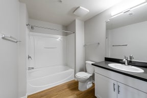a bathroom with a toilet sink and bathtub at K Street Flats, Berkeley, CA