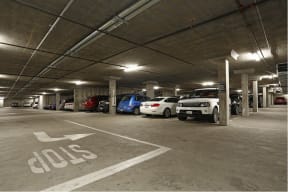a parking garage with cars in it at K Street Flats, California