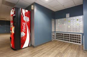 a coca cola vending machine in a blue room at K Street Flats, Berkeley, 94704