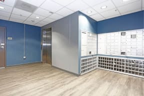 a locker room with blue walls and a wooden floor at K Street Flats, Berkeley, 94704 
