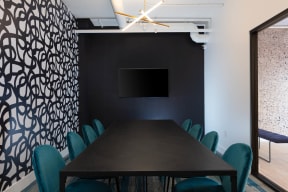 a conference room with a long table and green chairs at K Street Flats, Berkeley, 94704
