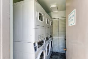 Mountain View, CA Apartments for Rent - Glenwood Gardens Laundry Room with stacked Washers and Dryers