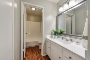 Bathroom with vanity and separate shower area