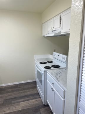Lake Meridian Shores apartment home kitchen with white appliances