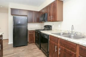 Langtry Village kitchen with black appliances and lots of countertop space